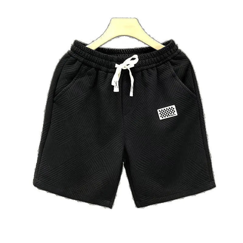 Men's solid colour polyester sports shorts with micro-elasticity, shown in black.