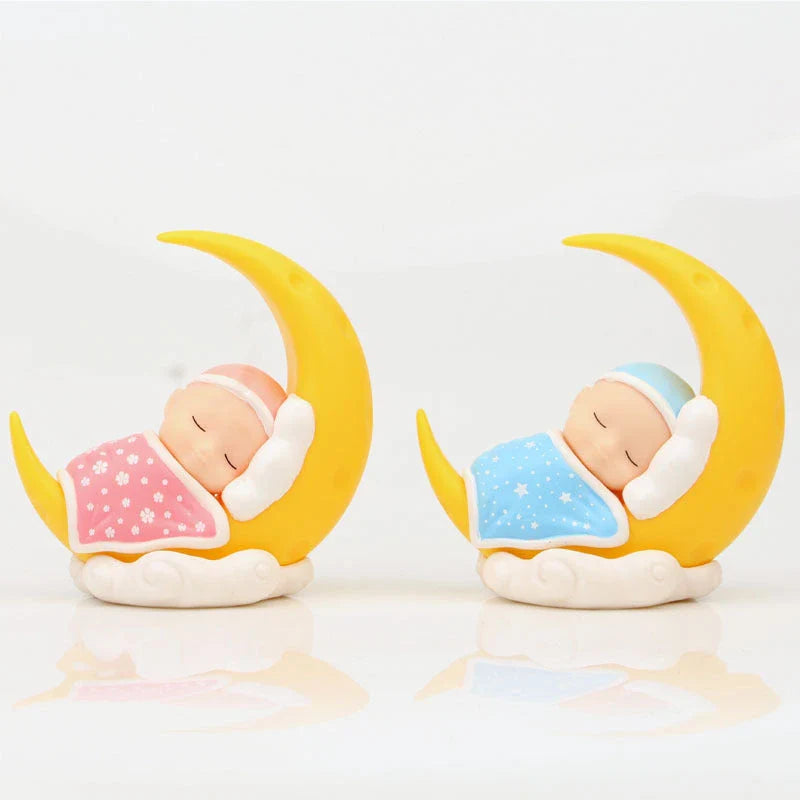 Adorable moon-themed cake decorations and party supplies for baby birthday celebrations