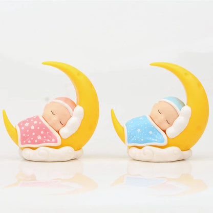 Adorable moon-themed cake decorations and party supplies for baby birthday celebrations