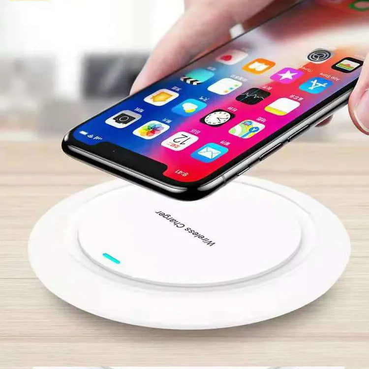 Round desktop wireless charger showing black and white colour options with USB cable