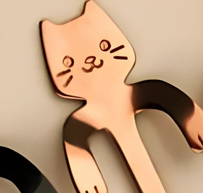 Stainless steel coffee spoon with cartoon cat handle showing hanging hole and smooth edges