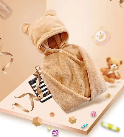 Blue hooded baby bath towel with dimensions 65cm by 110cm laid flat.