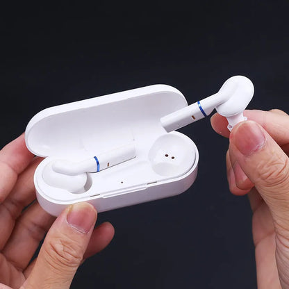 VV1 black and white Bluetooth wireless earphones with charging case showing in-ear design