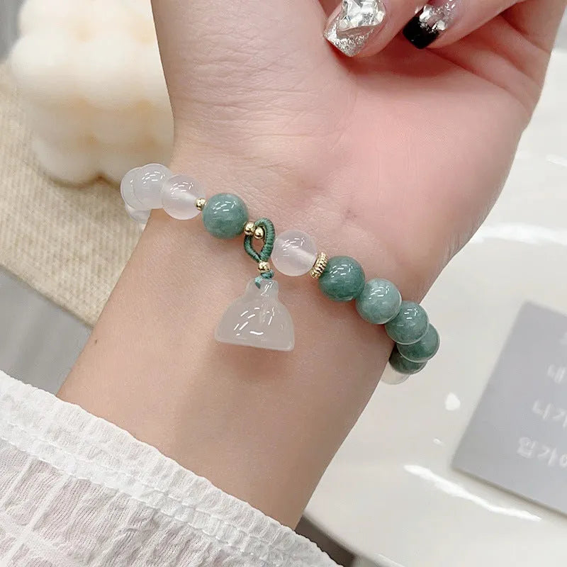 Women's retro Chinese style agate lotus seedpod bracelet showing natural stone patterns