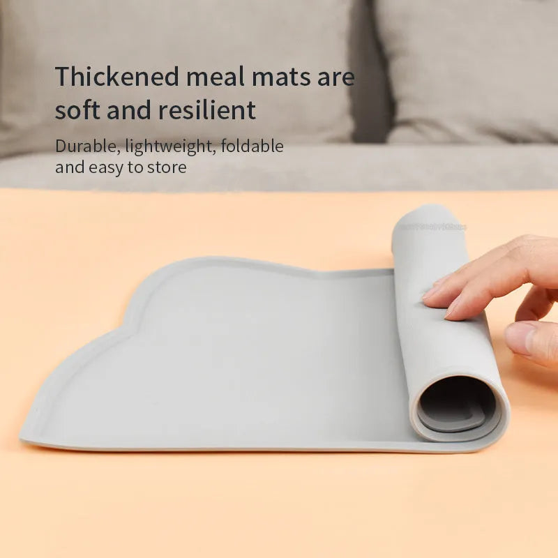 Solid-colour silicone pet feeding mat with cat head design measuring 44 by 24 centimetres