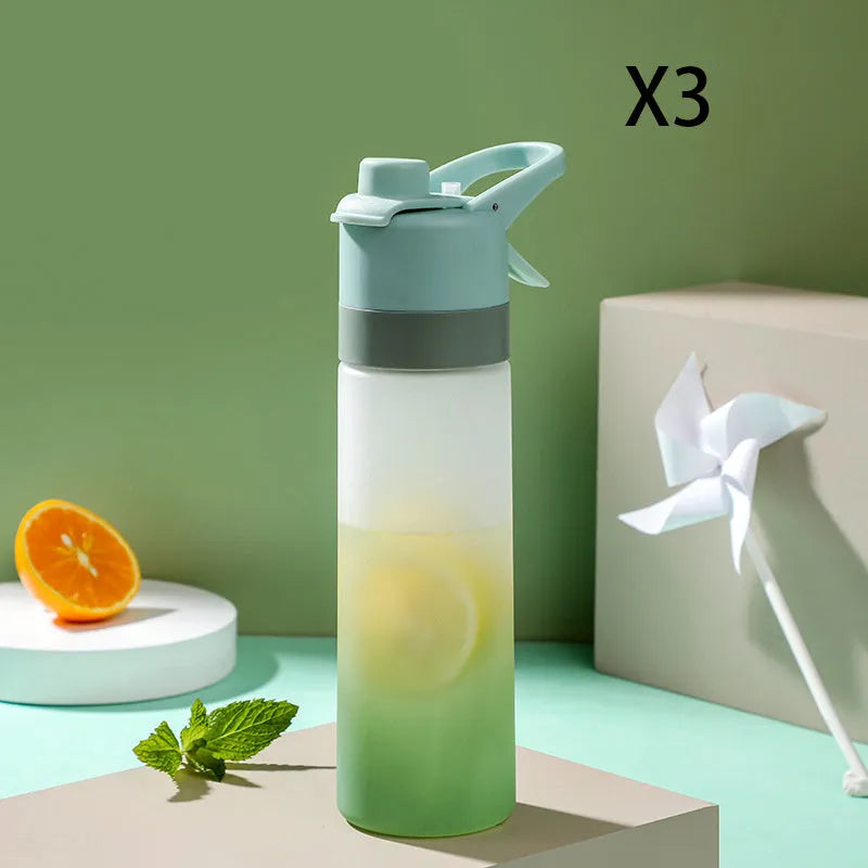 White spray water bottle with black leakproof lid and handle strap on a table