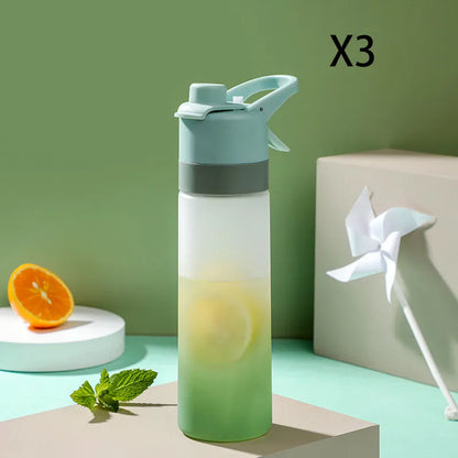 White spray water bottle with black leakproof lid and handle strap on a table