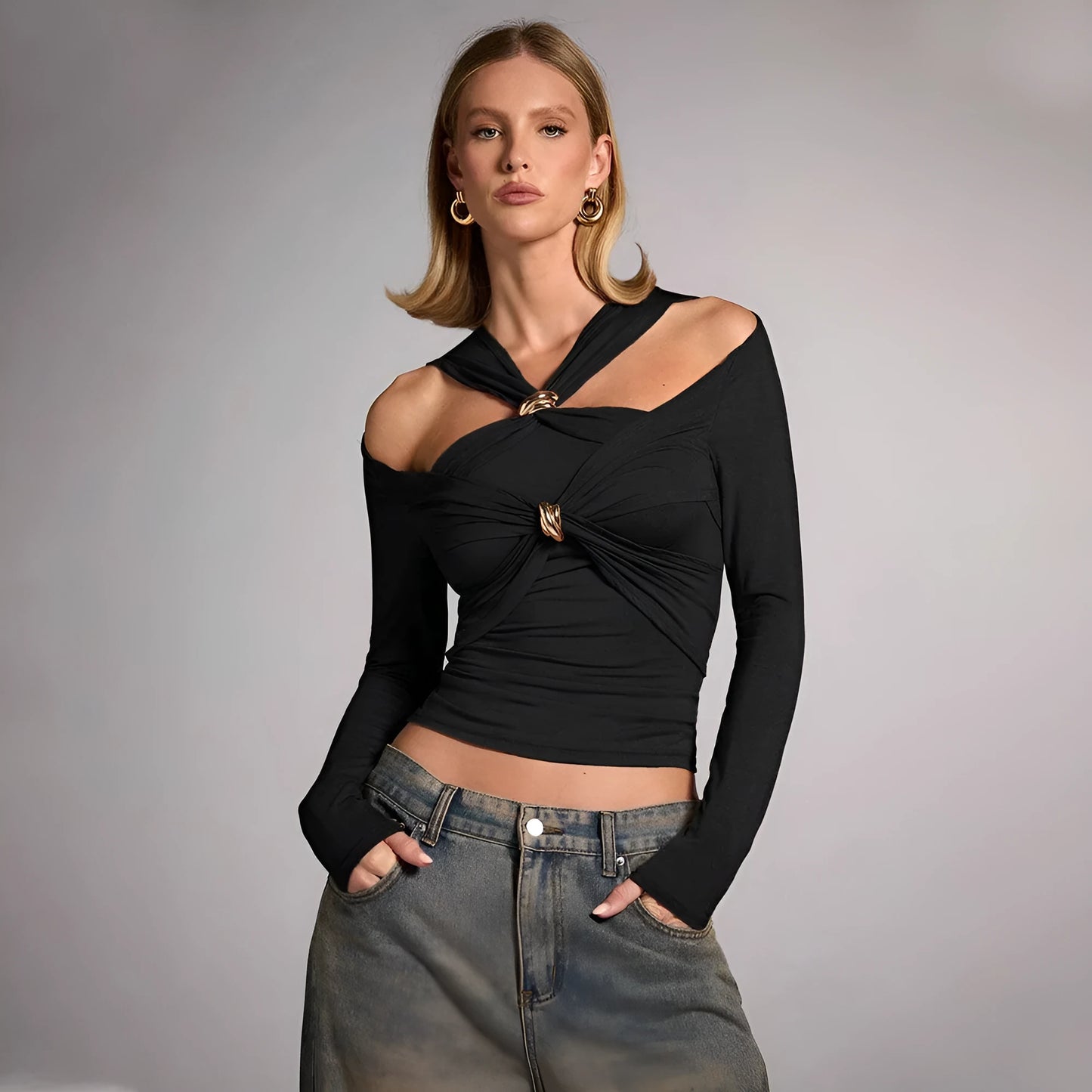 Black women's halter top with strapless design and long sleeves showing slim fit silhouette