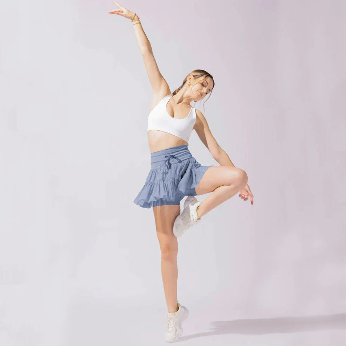 Stylish high-waist pleated skirt with lace-up accents in various colors, including black, gray, blue, apricot, pink, white, and purple