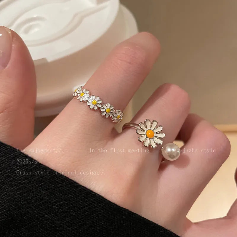 Women's copper opening sweet twin ring set showing little daisy pearl and little daisy ring designs