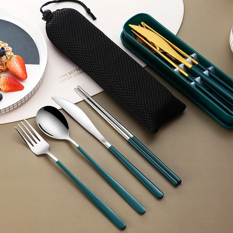 Gold and black stainless steel knife fork spoon set inside a grey mesh carrying bag.