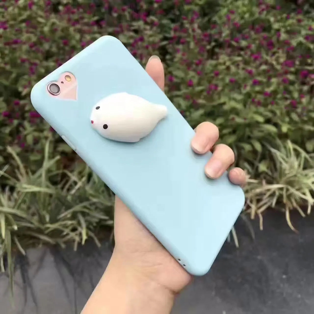 Silicone iPhone case with 3D cartoon cat design showing raised texture details