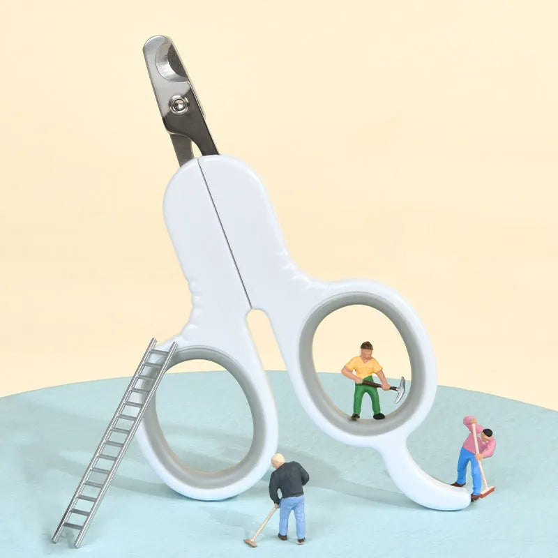 Grey and pink pet nail clippers with curved tips and a rubber-coated ergonomic handle on a table.