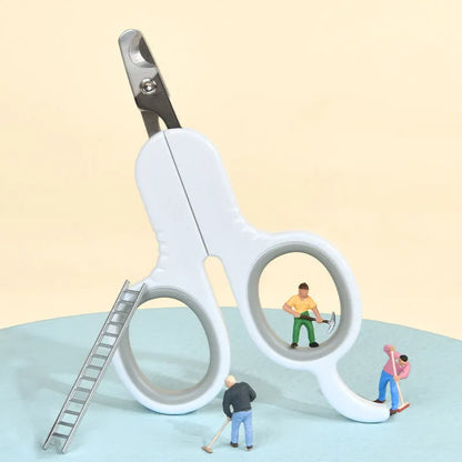 Grey and pink pet nail clippers with curved tips and a rubber-coated ergonomic handle on a table.