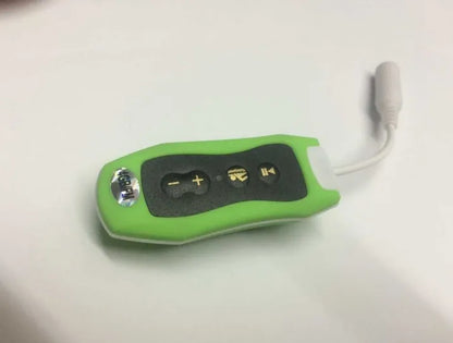 Compact black Bluetooth MP3 headset with clip, shown next to USB charging cable.