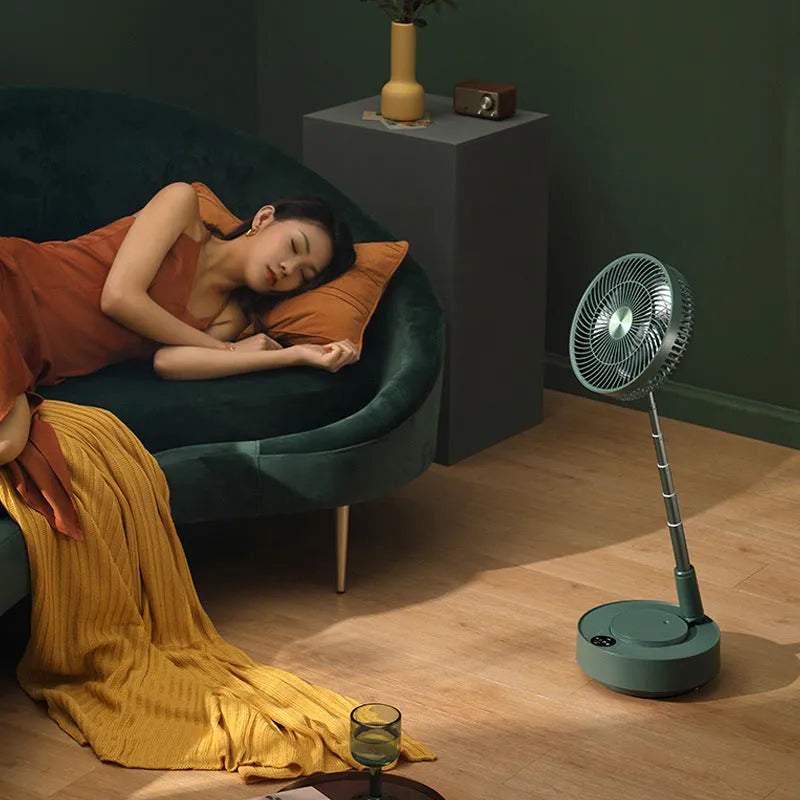 Green rechargeable floor fan with humidifier in extended position showing telescopic design