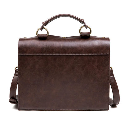 Bronze steampunk industrial retro shoulder bag with metal hardware on horizontal square pillow bag design