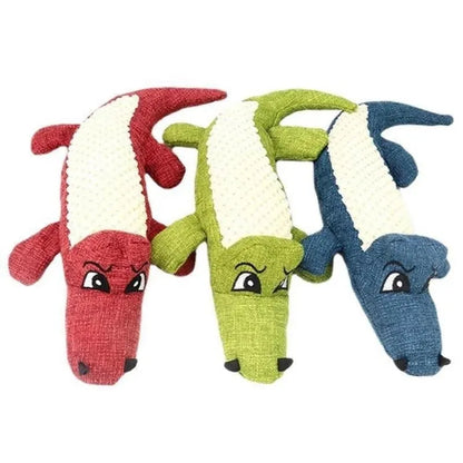 Blue corn grid plush toy for pets with biting sound function next to green and red versions.