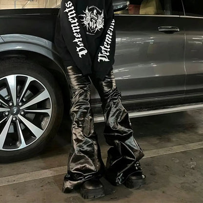 Black shiny patent leather coated skinny jeans with straight leg and mid waist