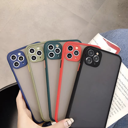 Solid colour silicone shockproof protective case for iPhone models on a table.