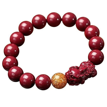 Purple gold sandstone cinnabar bracelet with totem design on a wrist, showing polished beads.
