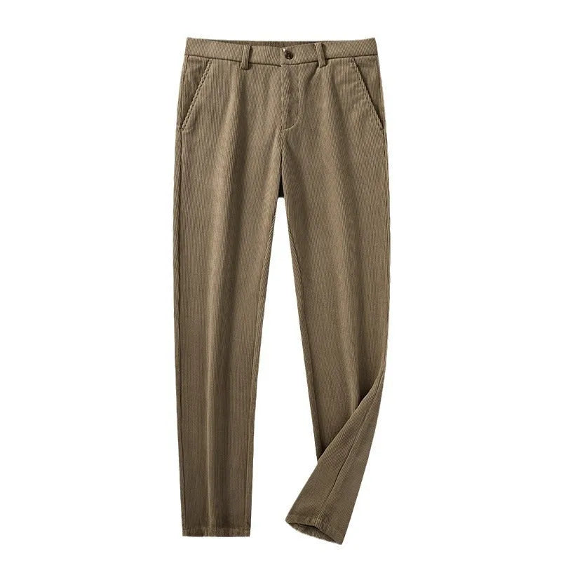 Man wearing khaki and black striped straight-leg retro trousers with a zip fly.