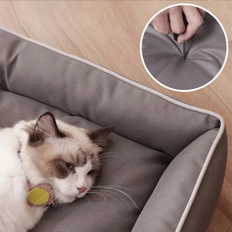 Waterproof dog sofa bed in grey Oxford cloth showing raised sides and rectangular shape