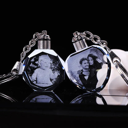 Custom laser-etched crystal photo keychain with internal colourful LED light activated, showing a personalised image.