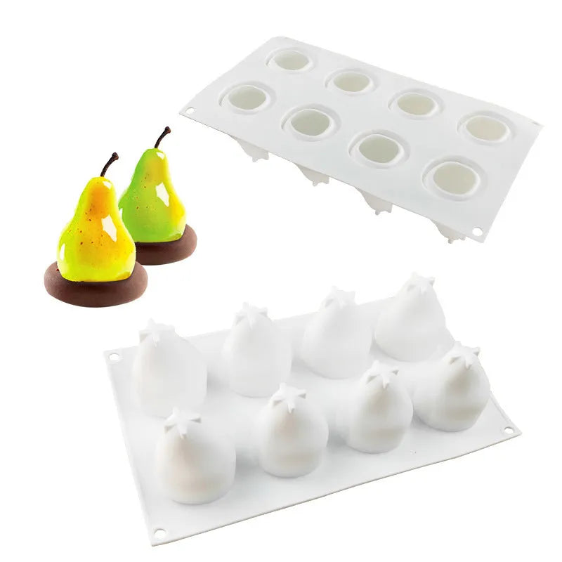 Flexible blue silicone baking mould with six cavities shaped like pineapples and pine cones on a kitchen counter.