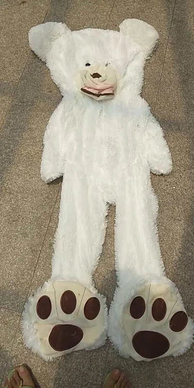 Colossal plush teddy bear in various sizes and colors, featuring a premium leather exterior and soft, cuddly interior