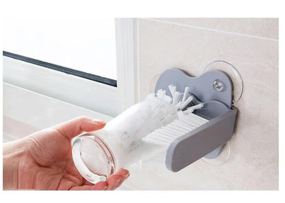 Grey suction cup brush with double-head design for cleaning cups and glasses