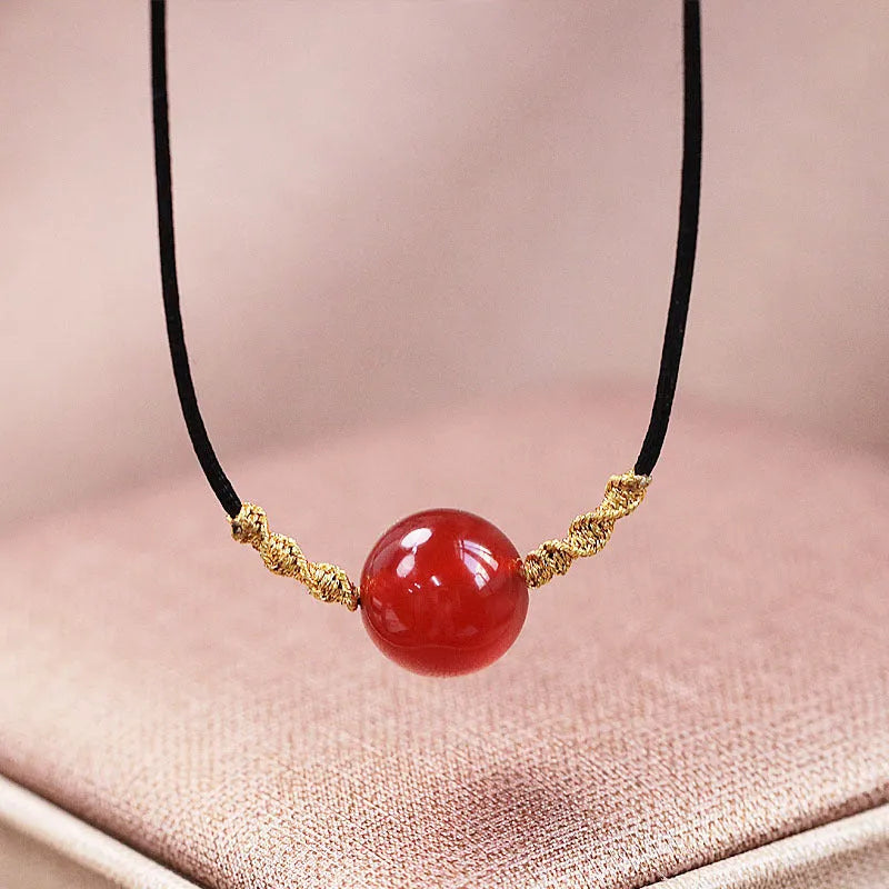 Hand-woven red agate bracelet and necklace set for women in national style with bead design.