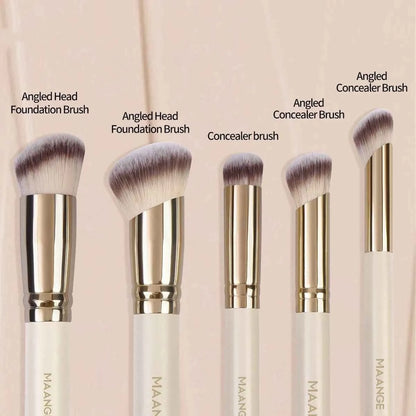 Apricot-coloured angled blush brush and four other synthetic makeup brushes on a white background