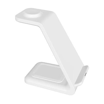 White 3-in-1 wireless charging station with phone upright in holder, watch and earbuds on charging pads
