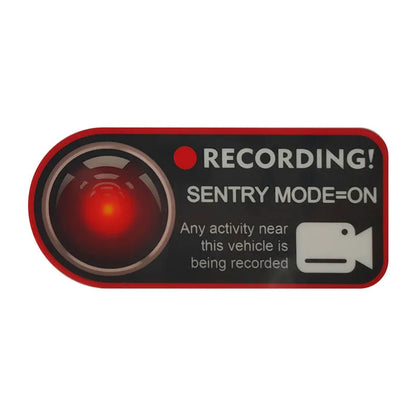 Pair of rectangular 11x5cm Tesla Sentry Mode warning stickers with English text on clear electrostatic backing.