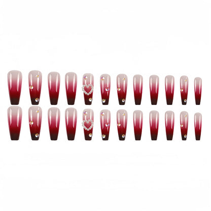 Set of long false nail tips with wine red gradient colour, plaid pattern, and a pearl heart design.