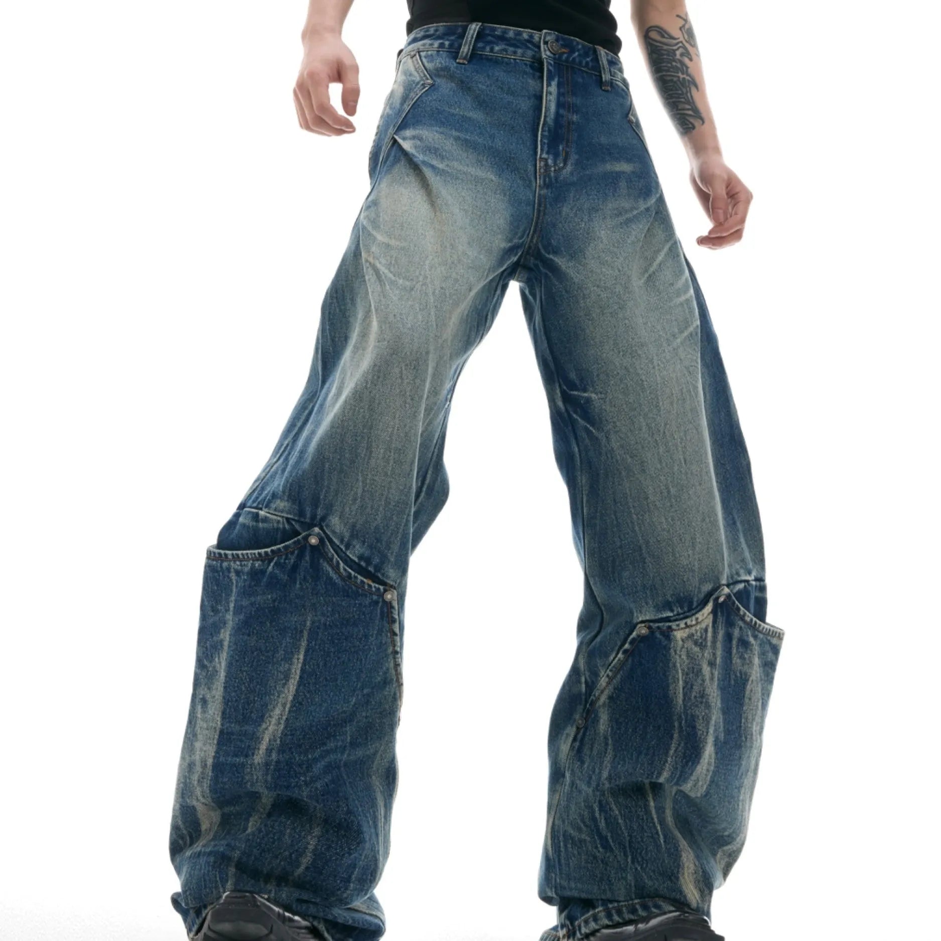 Men's verdant blue jeans with burst pattern, curved knife cut, and loose fit design