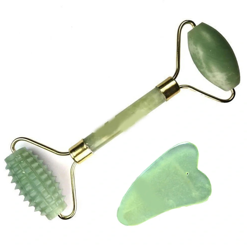 Natural green jade beauty massager with roller and scraper tools on white background