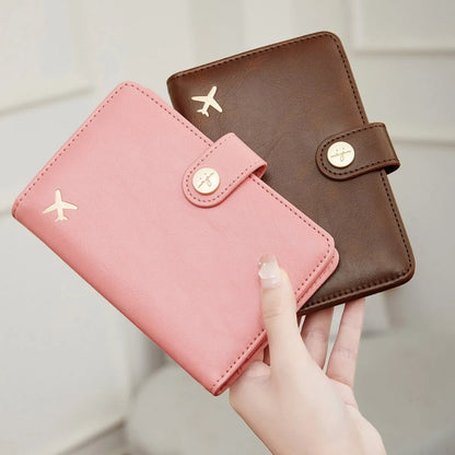 PU passport wallet with sewing line detail, shown in multiple colours including black, pink, and blue, featuring anti-theft swiping protection.