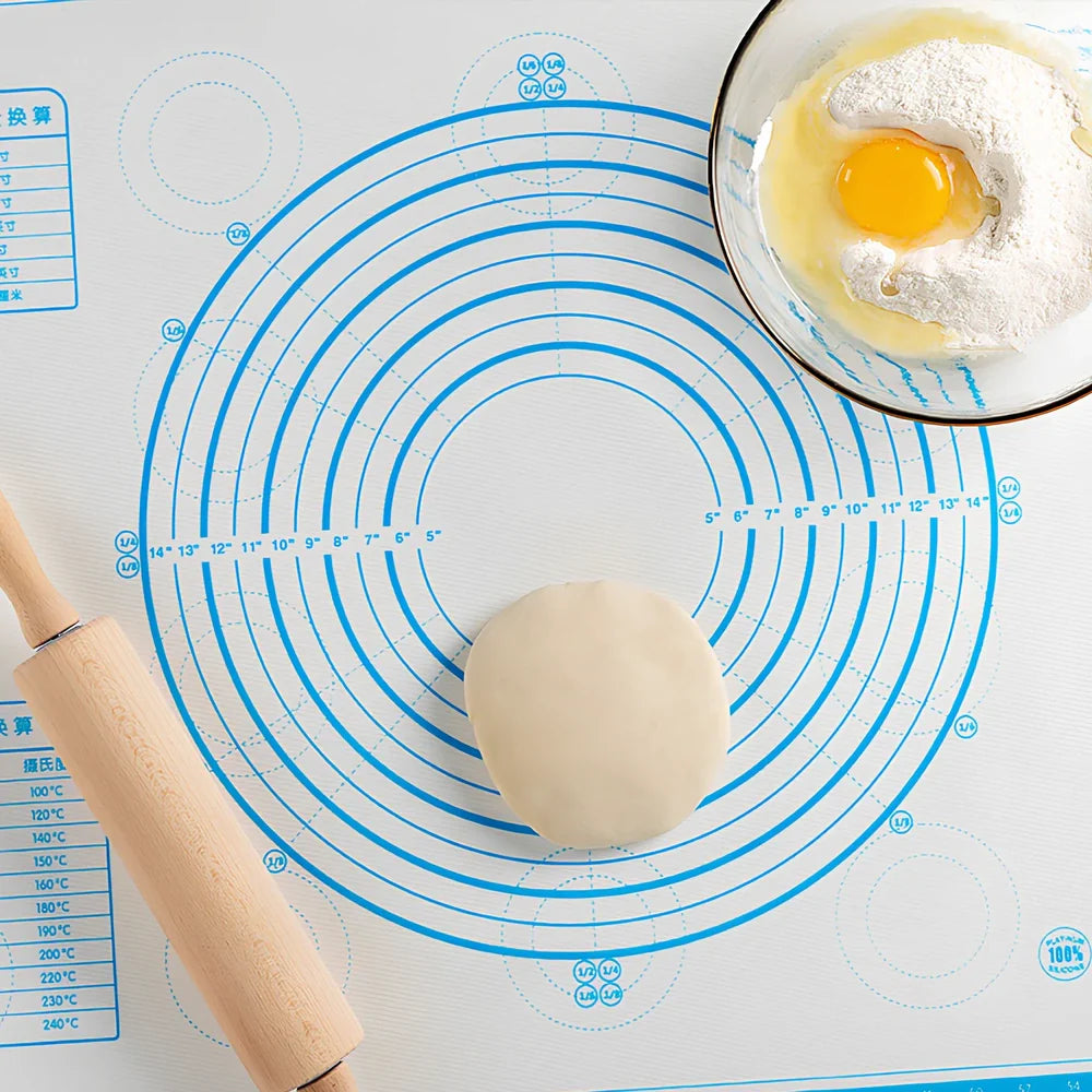 40x60cm black silicone baking mat with measurement guides on kitchen counter