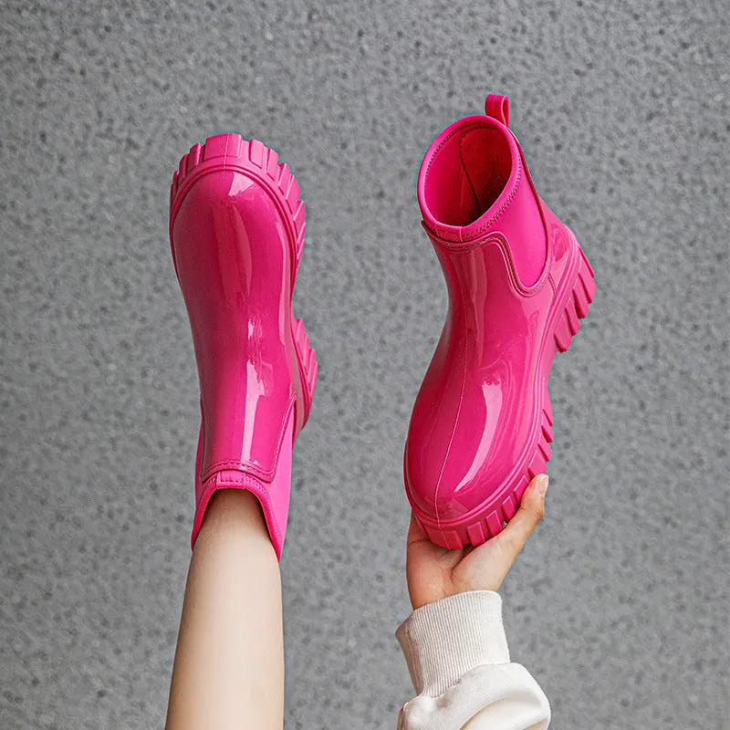 Women's creamy-white low tube PVC rain boots with a flat heel and thickening sole, shown from the side.
