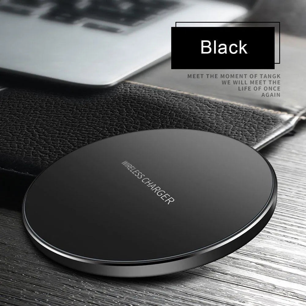 Black ultra-thin square wireless fast charging pad for phones on a desk