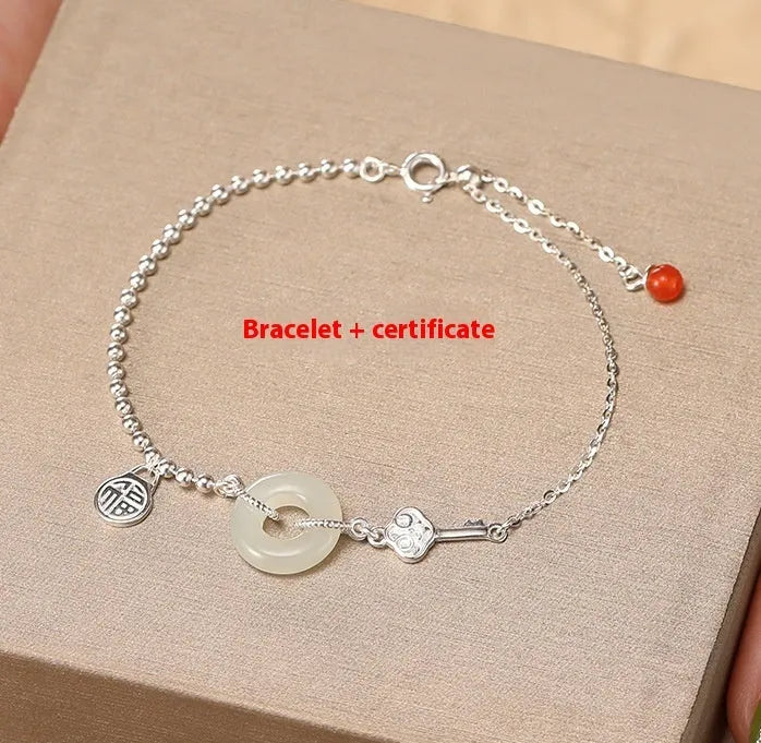 Silver women's bracelet with Hetian jade stones and a geometric peace buckle charm.