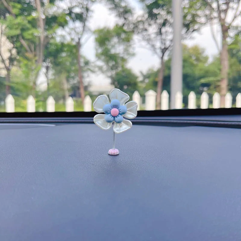 Small plastic car decoration swing measuring 5cm tall in blue, green, pink, purple, and yellow colour options