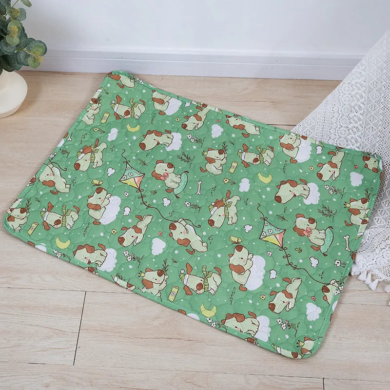 Reusable washable pet urine pad showing colourful animal pattern and waterproof backing.