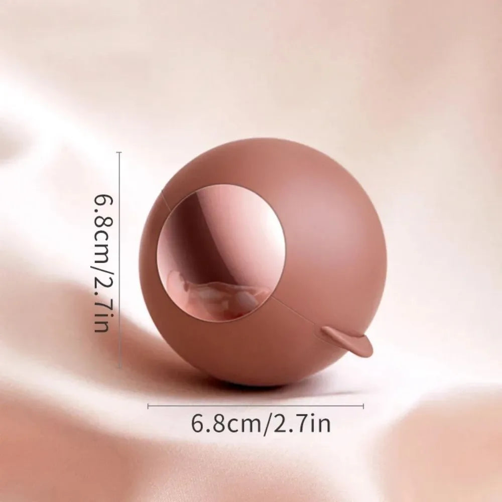 Washable reusable lint roller ball with handle for removing pet hair from fabrics.