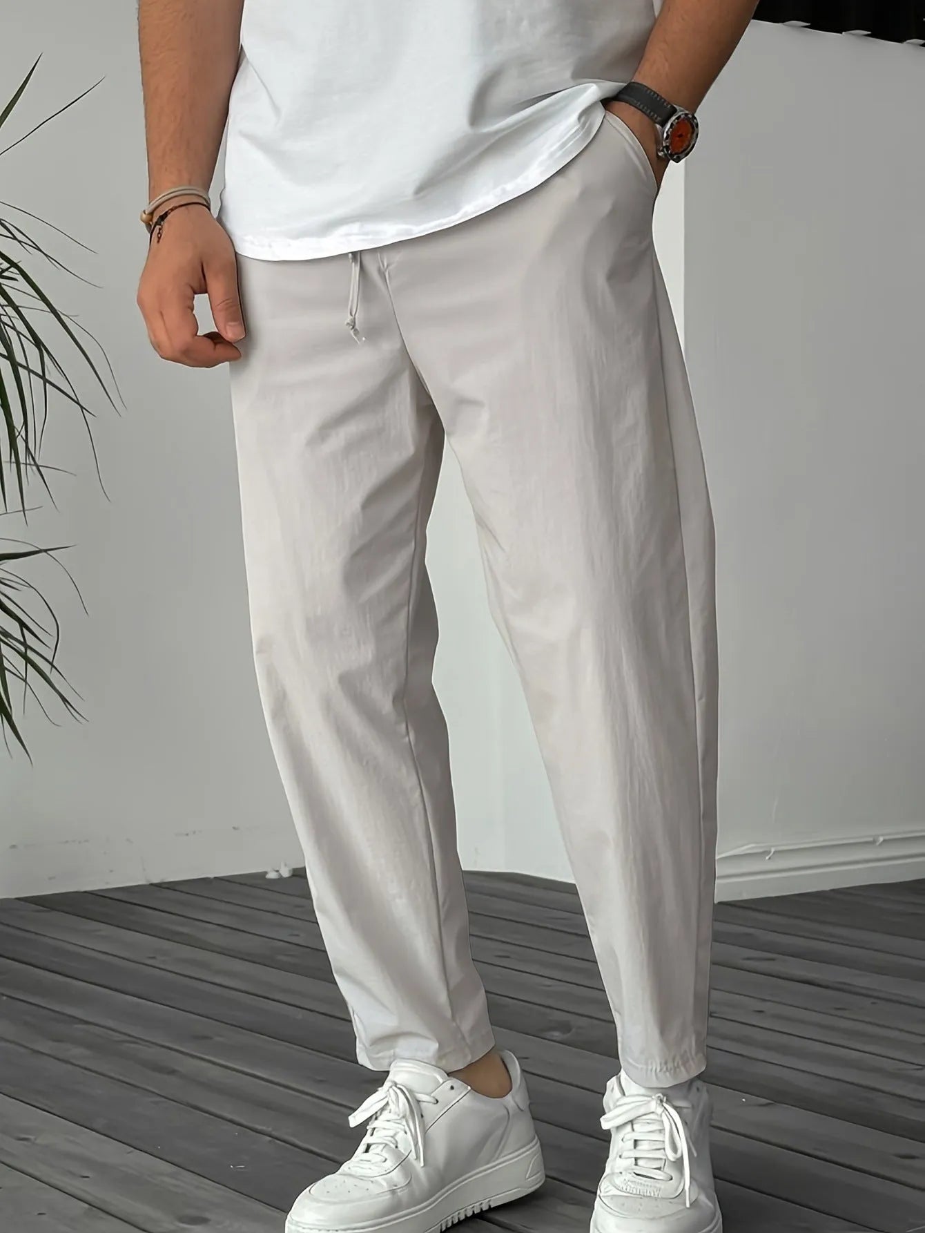 Men's khaki drawstring trousers with ribbon-trim pockets and straight-leg fit