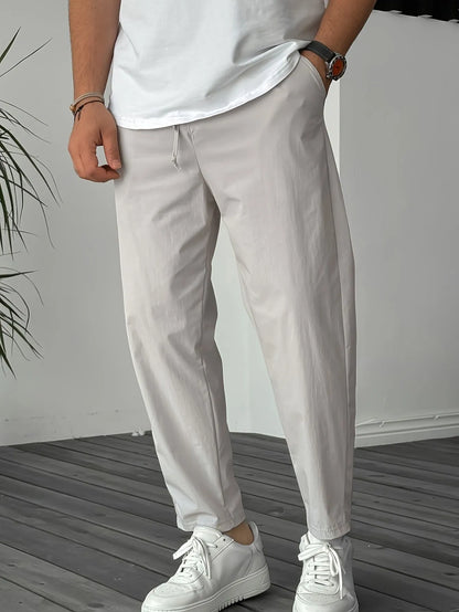 Men's khaki drawstring trousers with ribbon-trim pockets and straight-leg fit