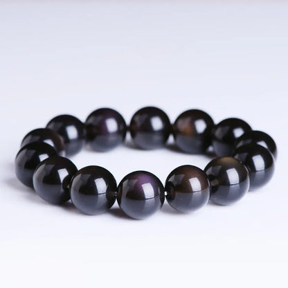 Natural crystal Pi Xiu bracelet with geometric beads on a wrist, showing ice stone colour.