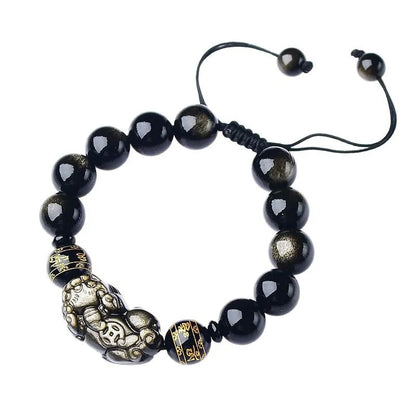 Handmade golden obsidian Pi Xiu bracelet with Chinese zodiac design on wrist.